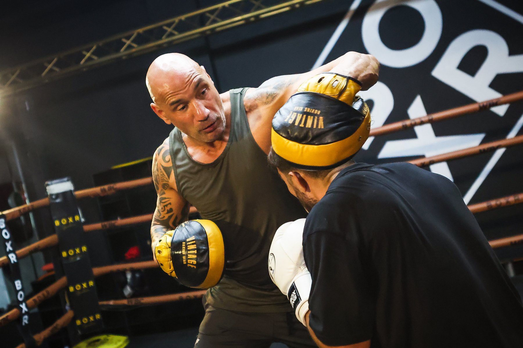 Me working the mitts with a fighter in the ring