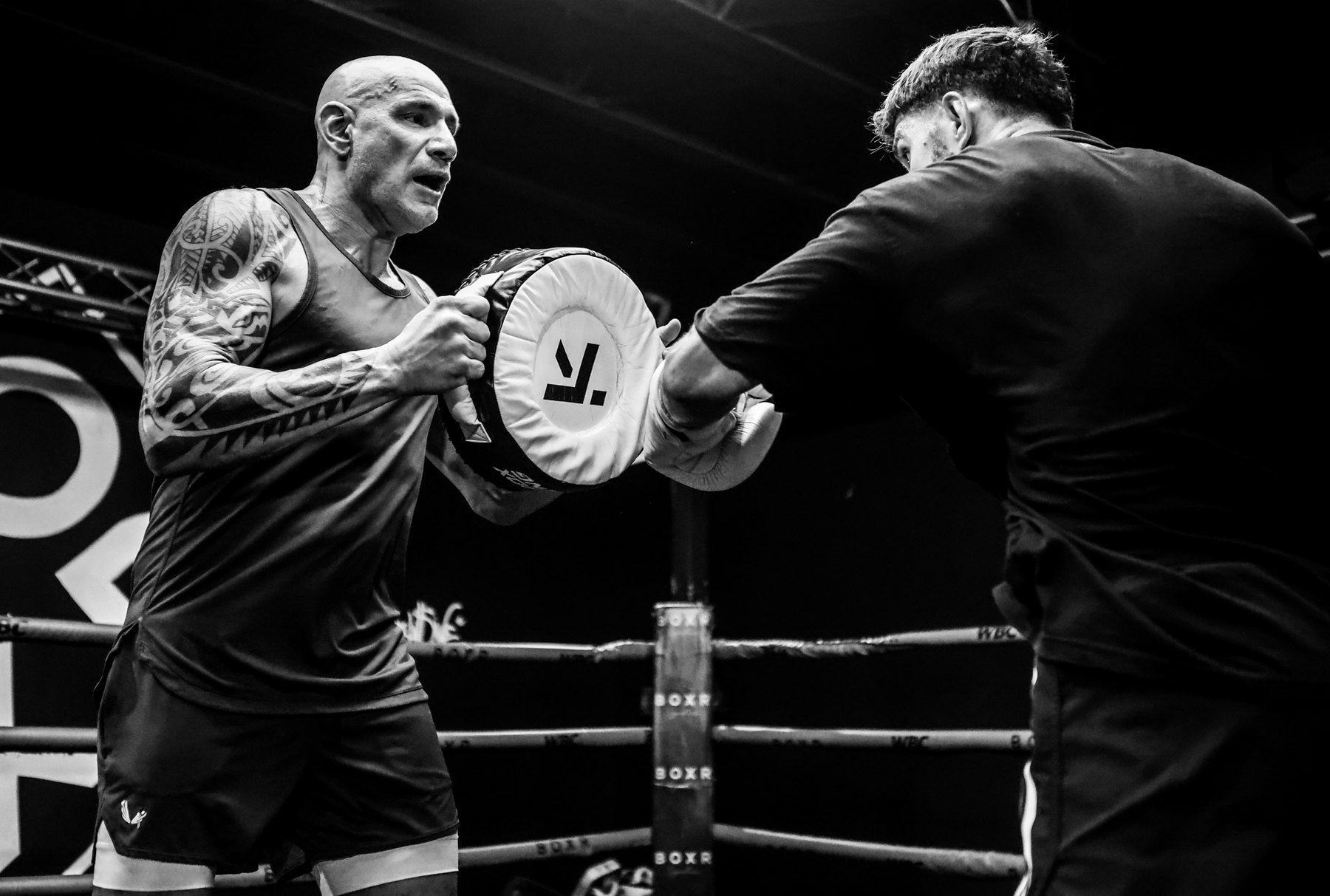 Me holding pads for a fighter in the Miami ring